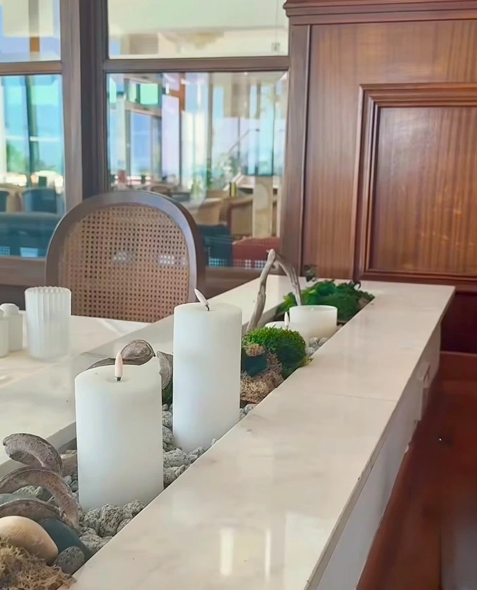 Biophilic moss installation with preserved foliage and natural elements in an elegant interior